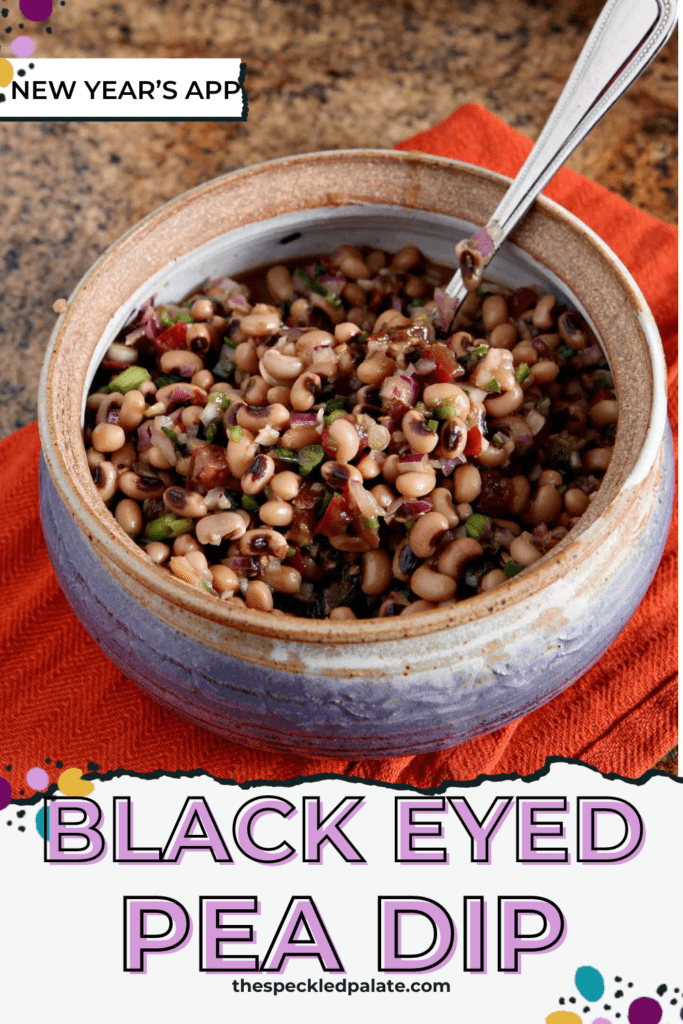 Close up of a bowl holding black eyed peas mixed with other veggies and the text black eyed pea dip