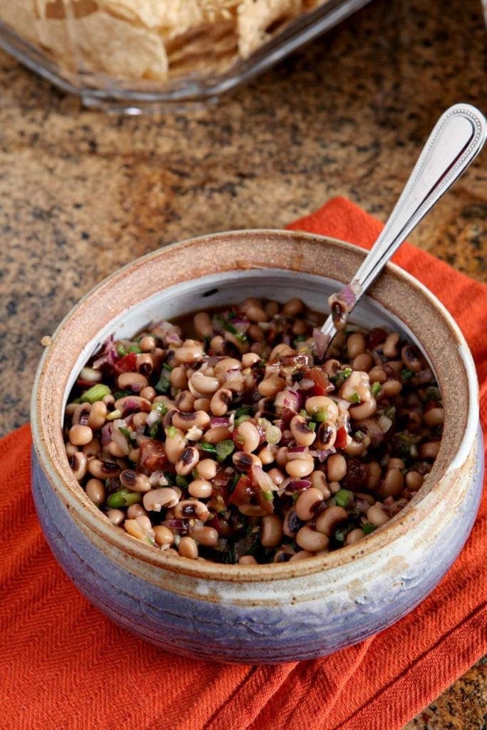 Overhead picture of Black Eyed Pea Dip in bowl with spoon 