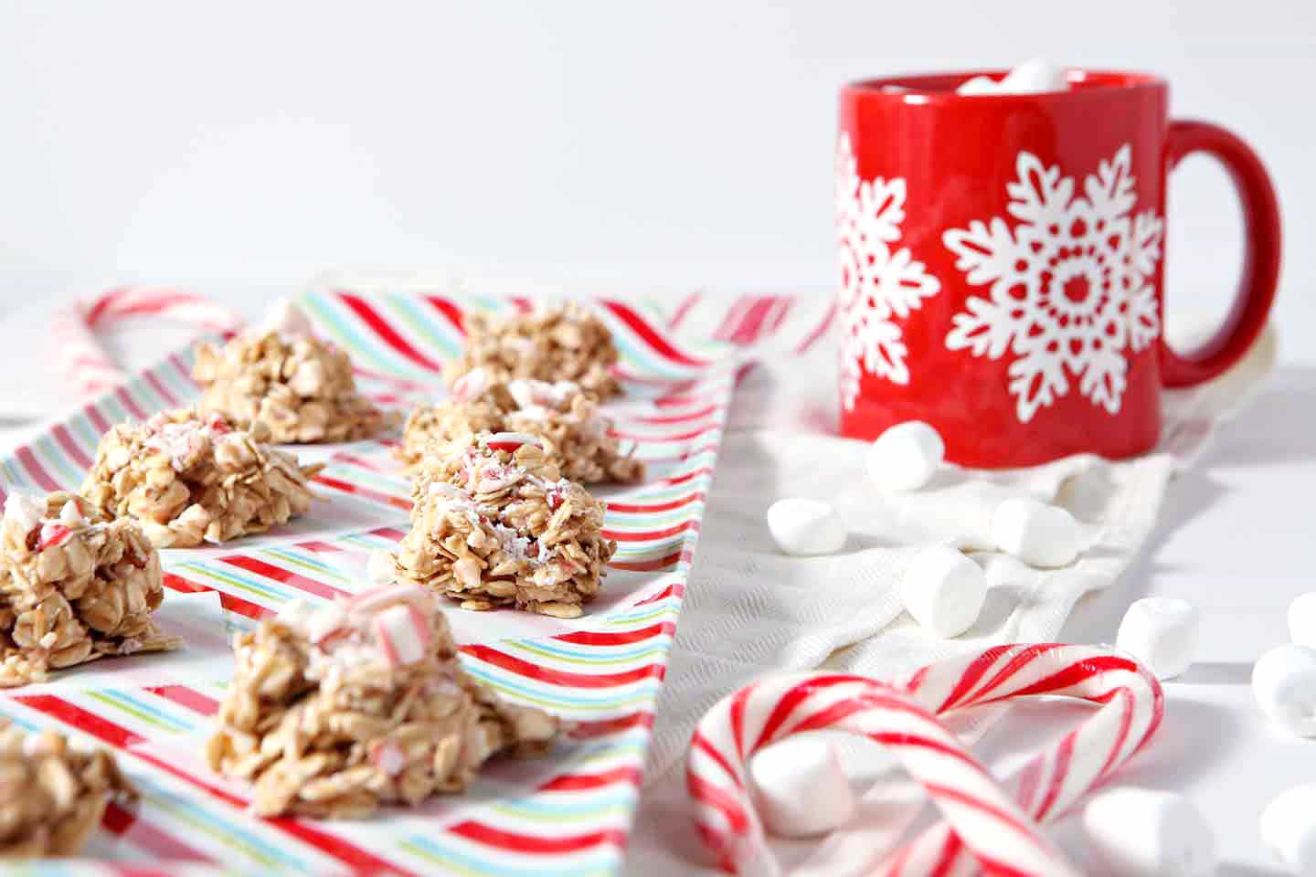 no bake peppermint bark cookies with a red mug in the background