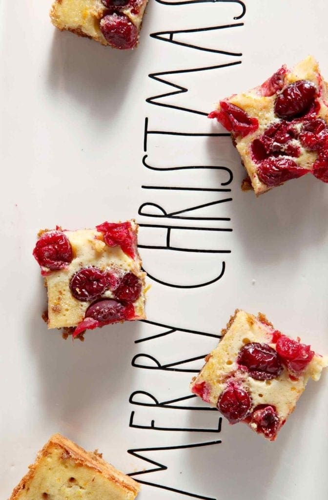 Orange Cranberry Bars on a Merry Christmas plate 