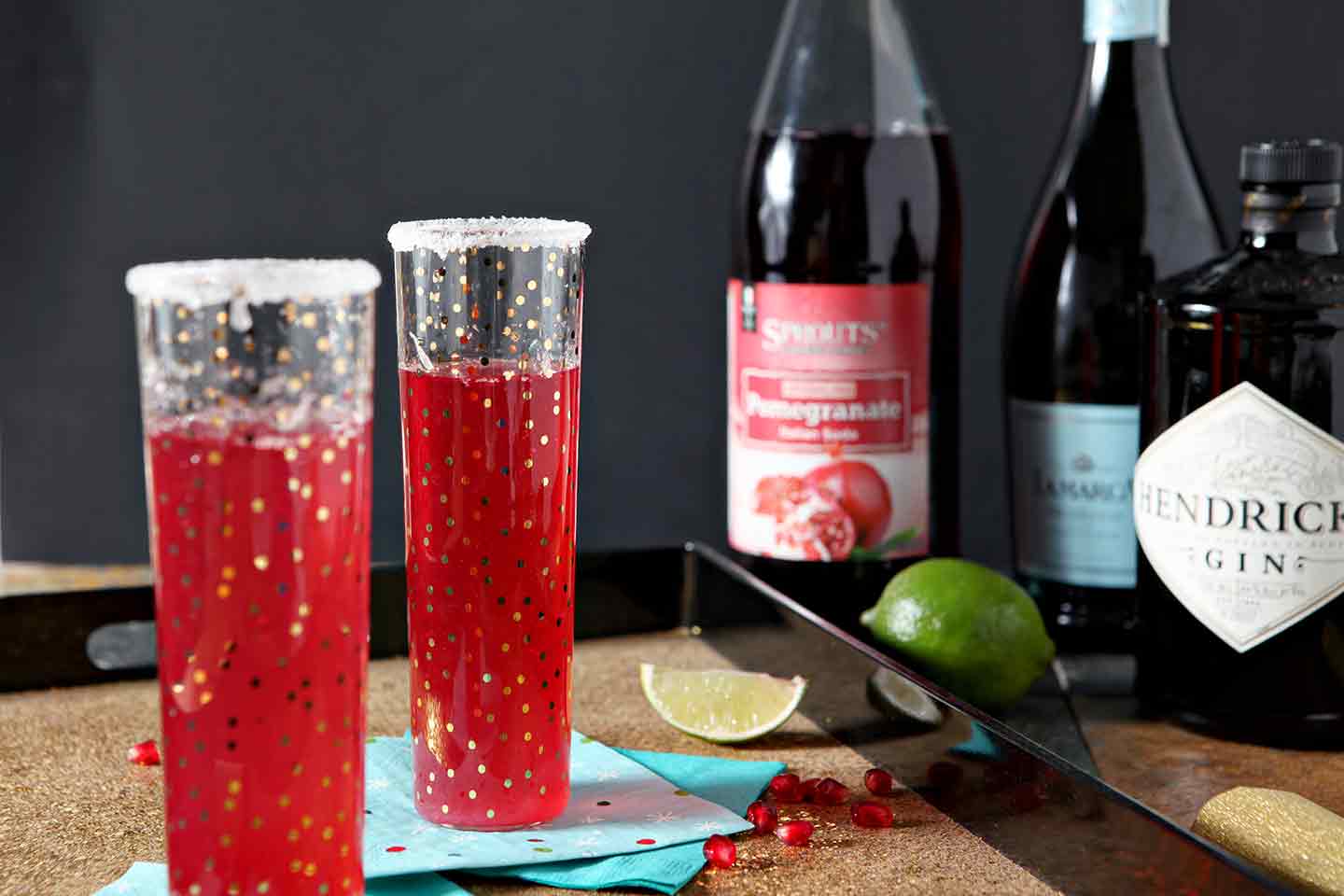 pomegranate french 75 in two polka dot glasses