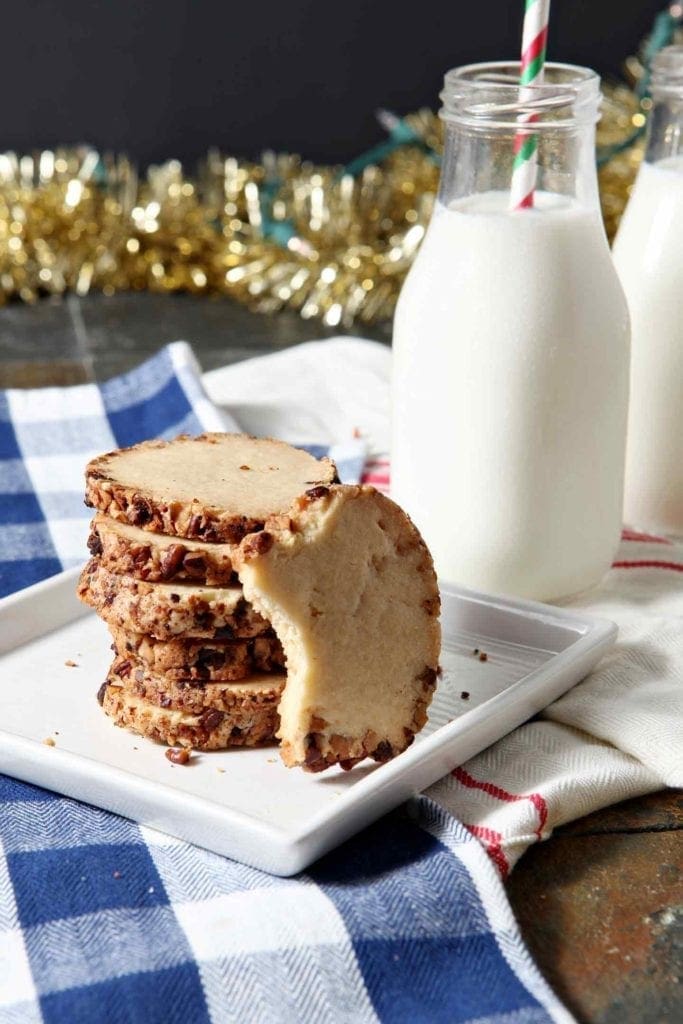 toasted pecan shortbread stacked on a white plate