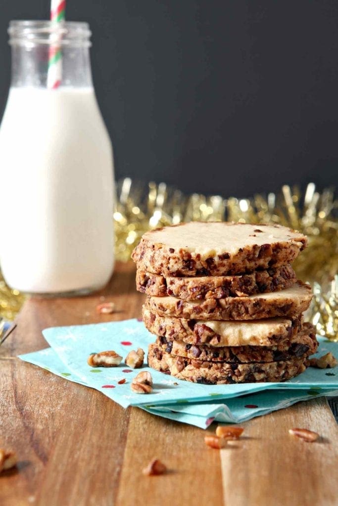 toasted pecan shortbread cookies stacked on a blue napkin