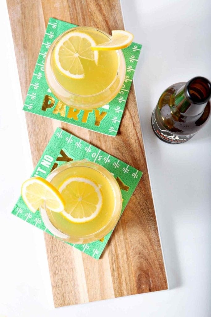 Overhead picture of meyer lemon shandy garnished with lemon slices 