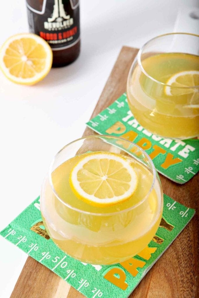 Overhead picture of Sliced Lemon on Lemon Shandy in a glass 