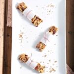 Overhead picture of granola bars on white plate