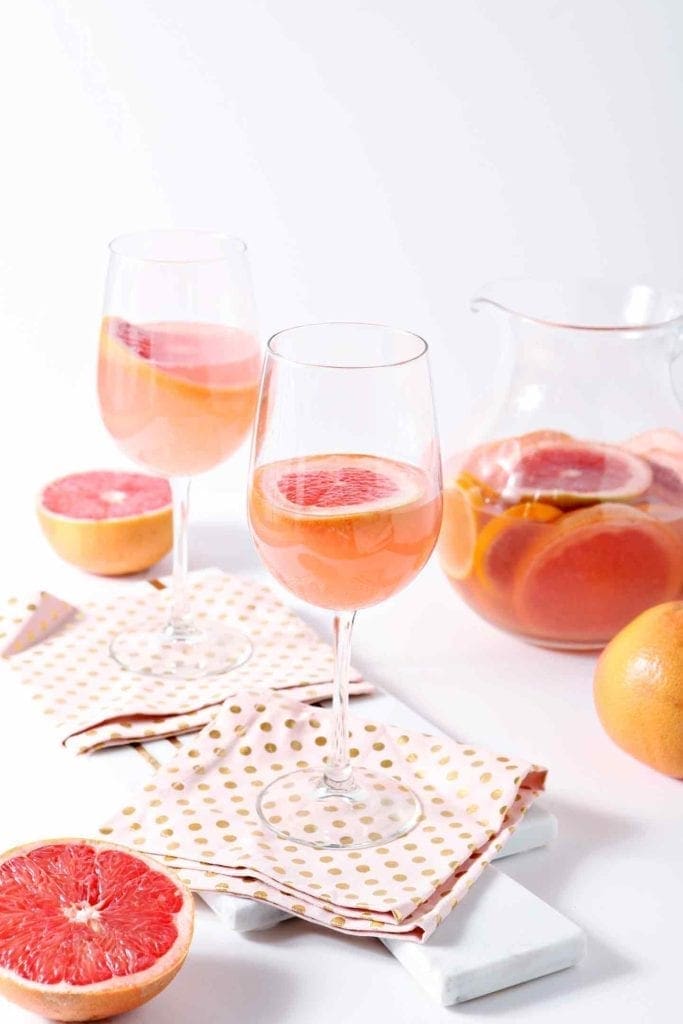 sparkling grapefruit sangria in glasses and a pitcher