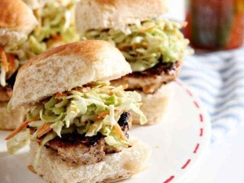 A platter of BBQ Chicken Burger Bites sits on a table before serving at a party