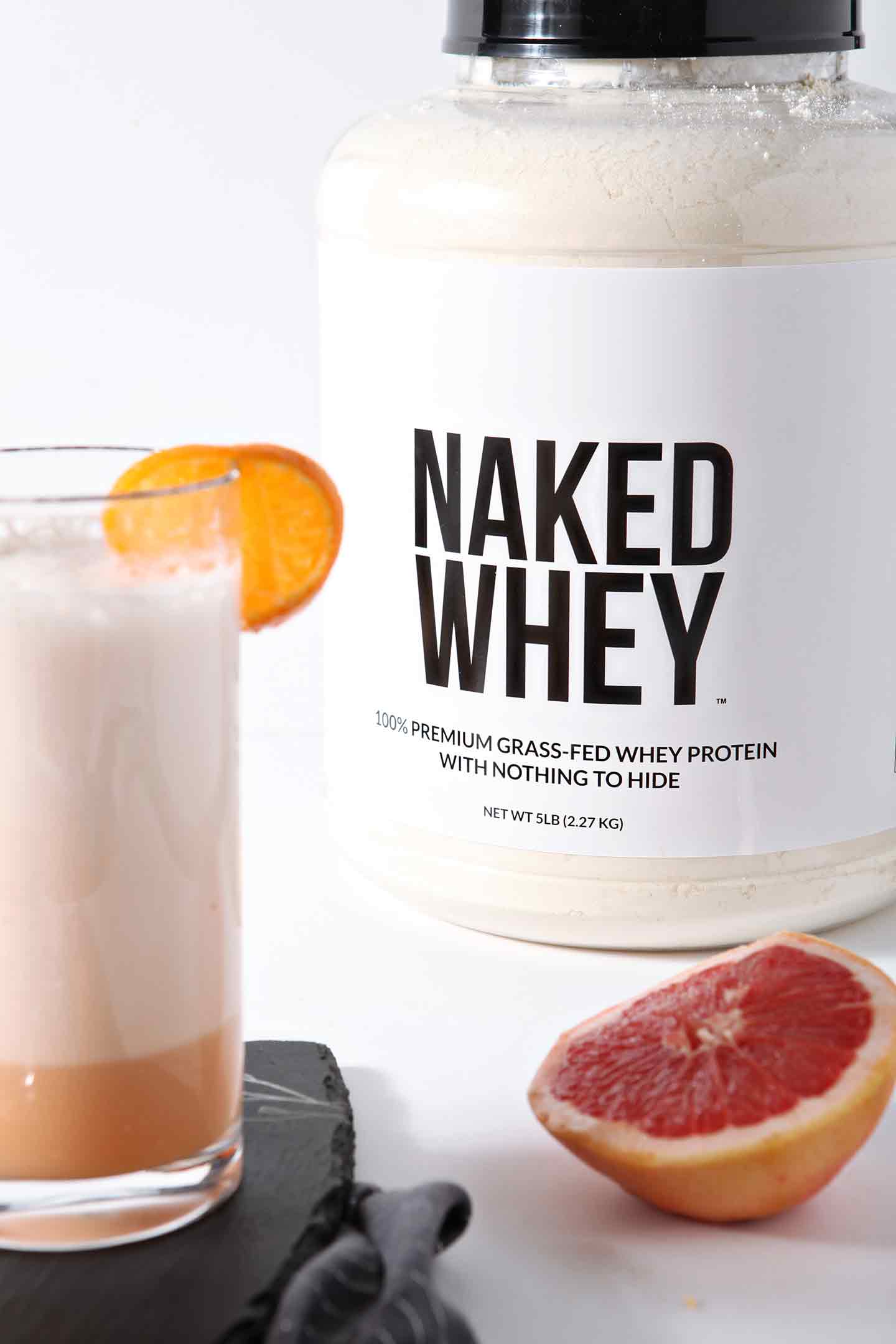 Citrus Smoothie in glass and package of naked whey 