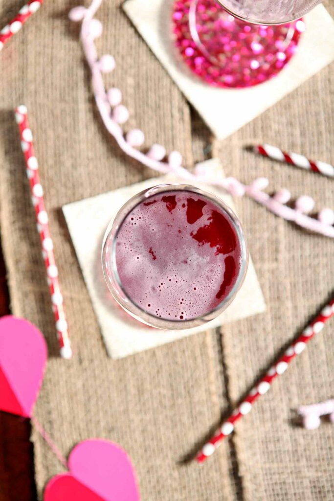 Overhead image of Framboise Champagne Cocktail on a tabletop