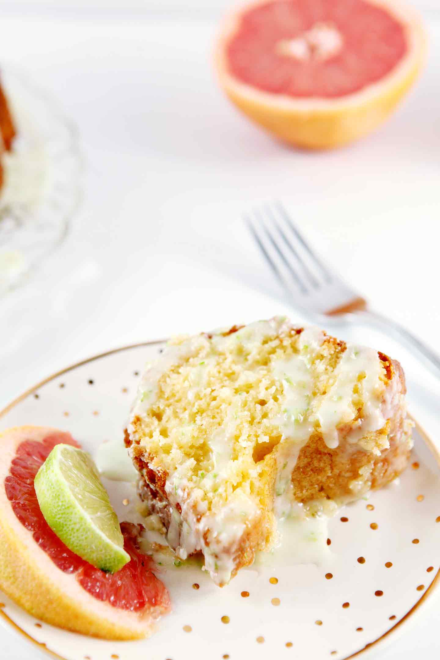 paloma citrus cake on a plate with a fork