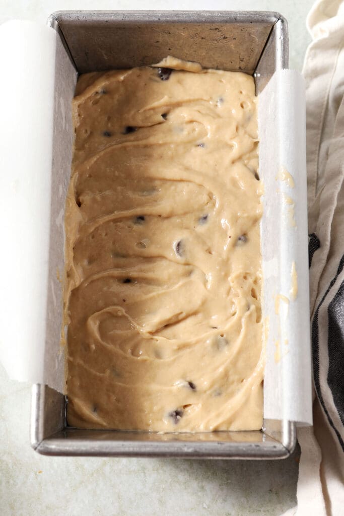 Cake batter in a loaf pan before baking