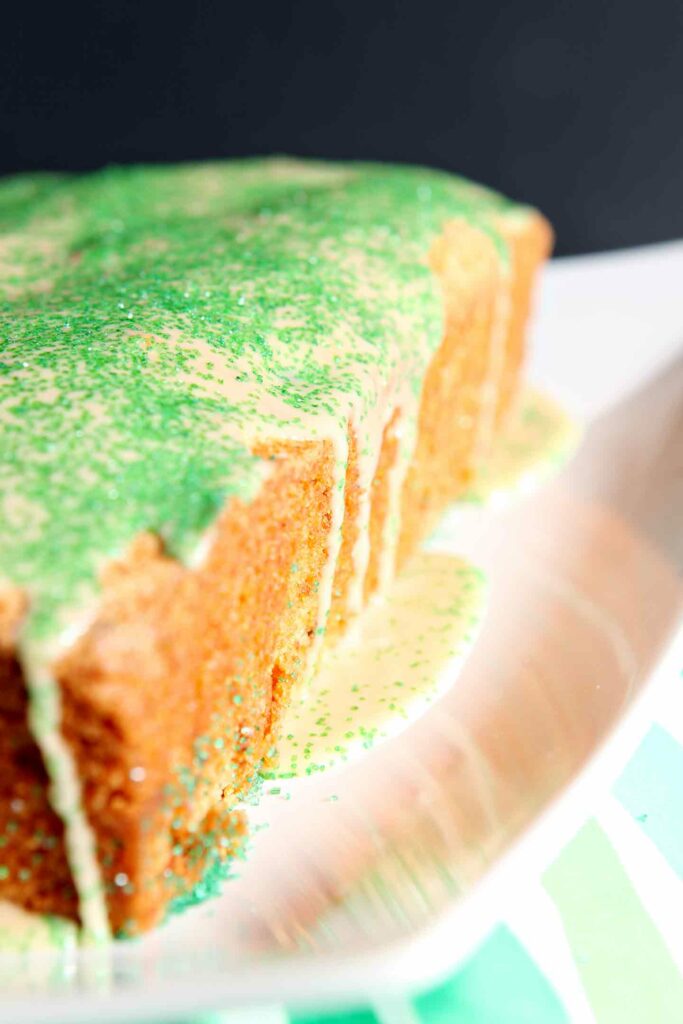 Close up of Irish Cream Glaze drizzling down the side of a cake