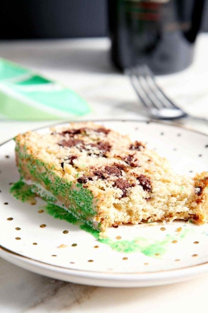 Close up of a Chocolate Chip Irish Cream Pound Cake slice with a bite taken out of it
