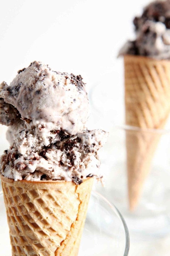 Close up of two ice cream cones in glasses