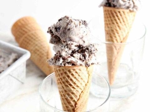 Two cones of No Churn Guinness Brownie Ice Cream are shown in glasses