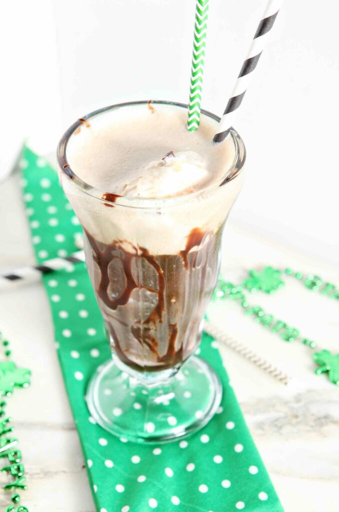 A float in a parfait glass on a green polka dot napkin