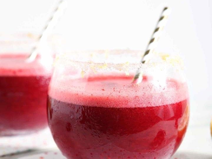 two cherry lemonade margaritas on polka dot napkins