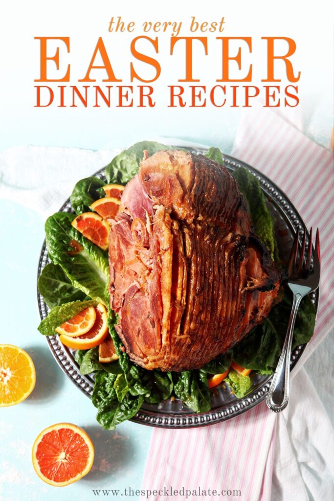 A roasted ham with sliced citrus on a turquoise surface with the text 'the very best easter dinner recipes'