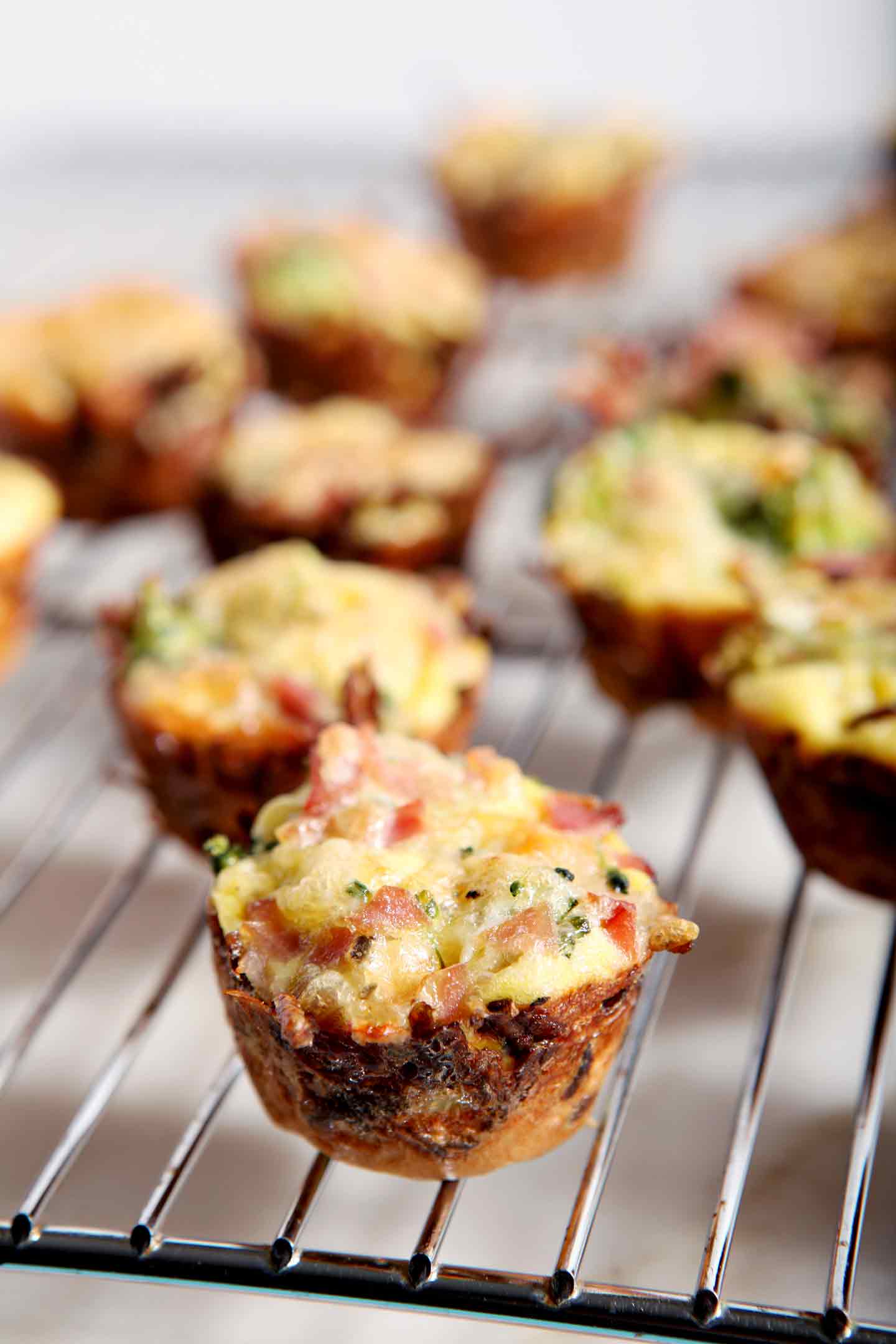 quiche lorraine bites on a cooling rack