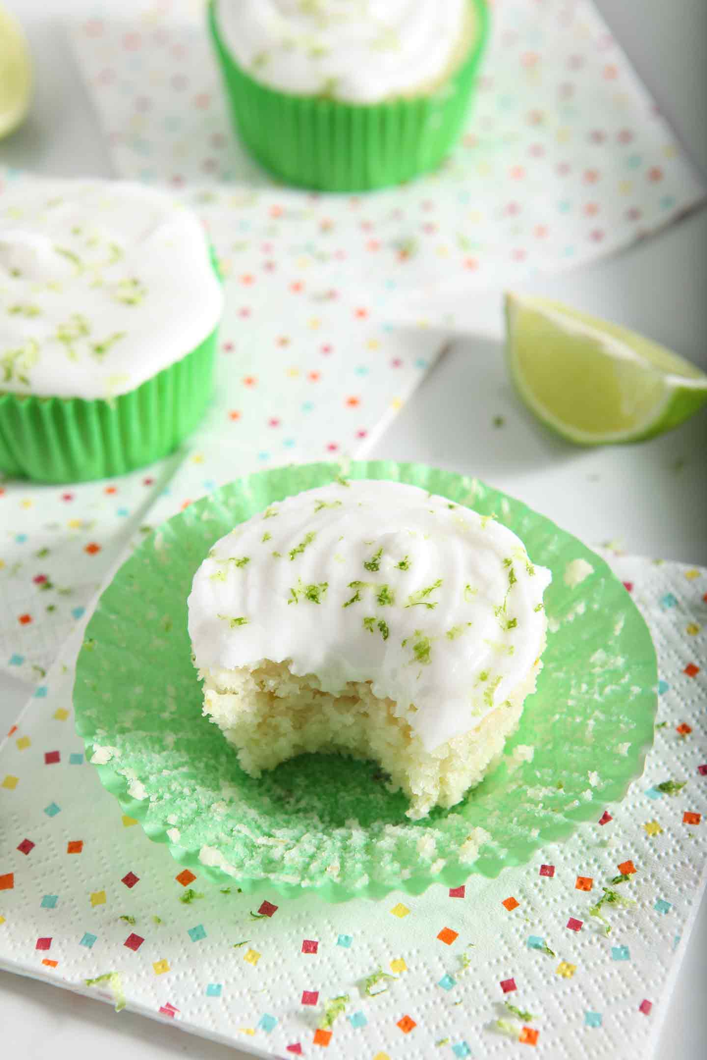 margarita cupcakes in green wrappers and a lime wedge