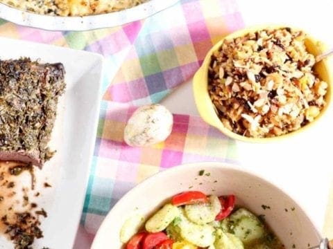 Bowl Of Mediterranean Cucumber salad with other side dishes