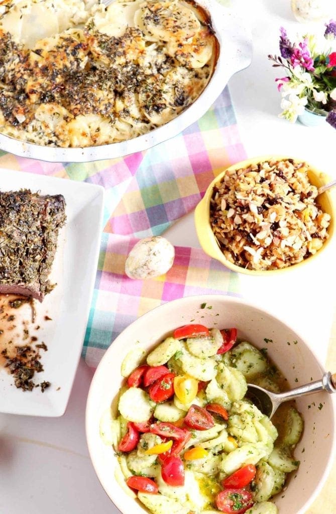 Bowl Of Mediterranean Cucumber salad with other side dishes 