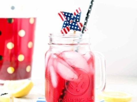 blackberry lemon whole30 tea in a mason jar with a black straw