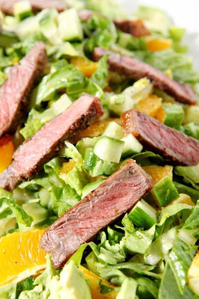 close up of orange steak salad