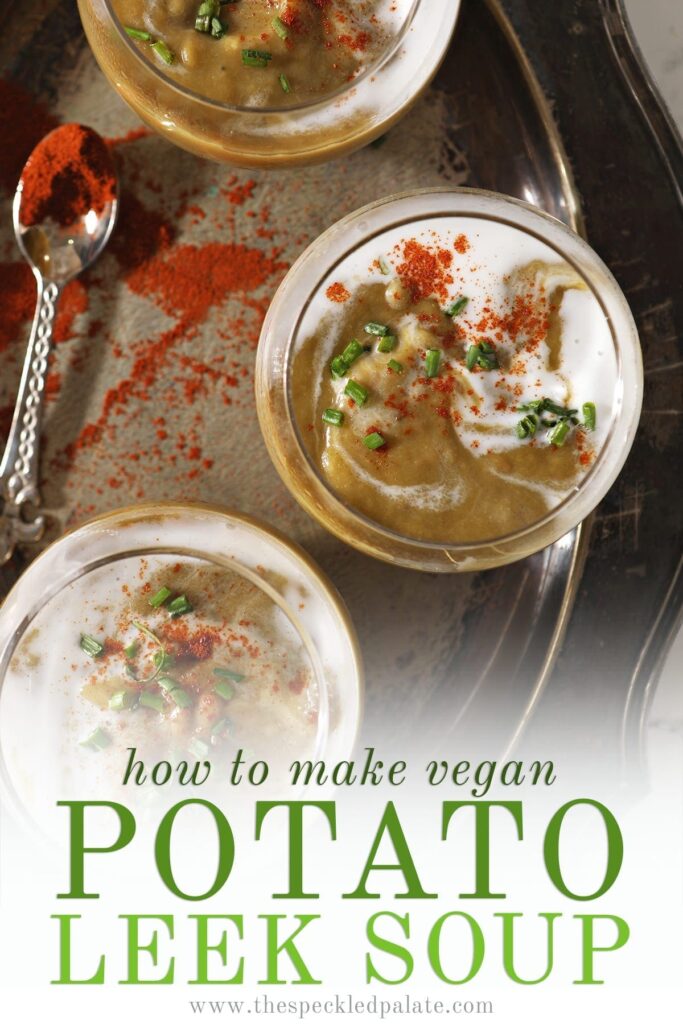 Three bowls of vegan potato leek soup from above on a silver tray next to a spoonful of paprika with the text 'how to make vegan potato leek soup'