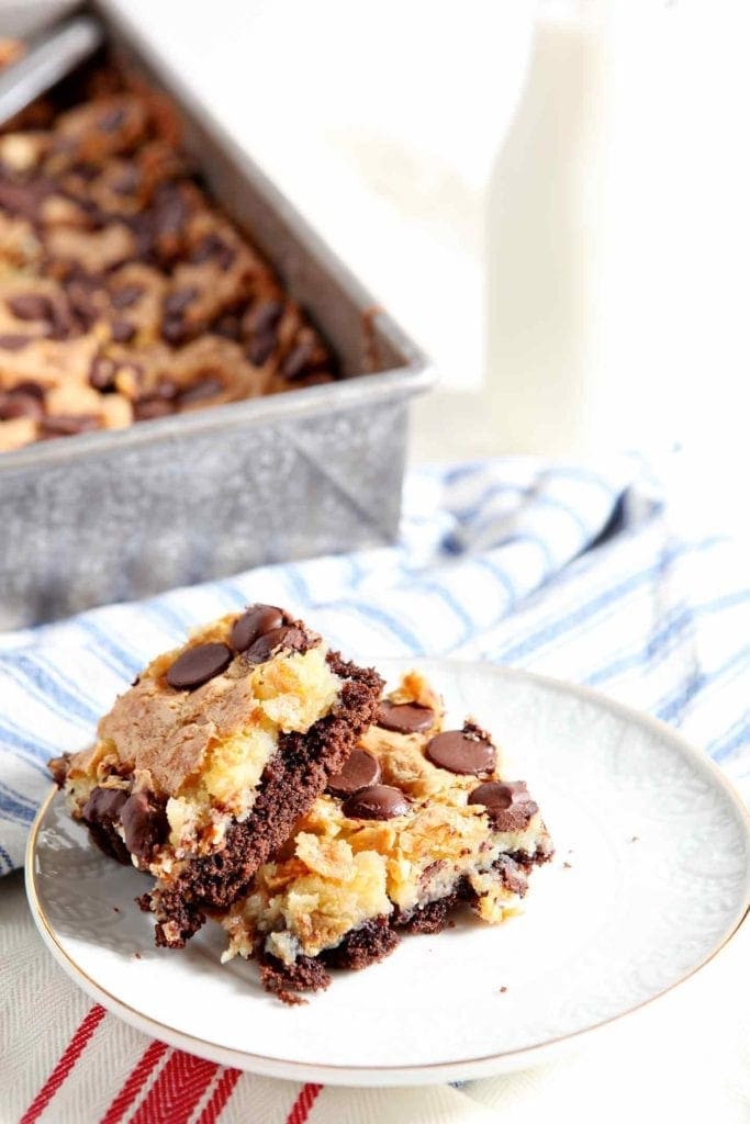 Two stacked Ooey Gooey Bar on a white plate