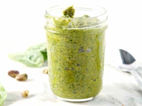 spinach pistachio pesto in a glass jar