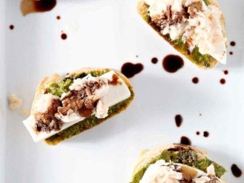 tuna pesto crostini on a white plate