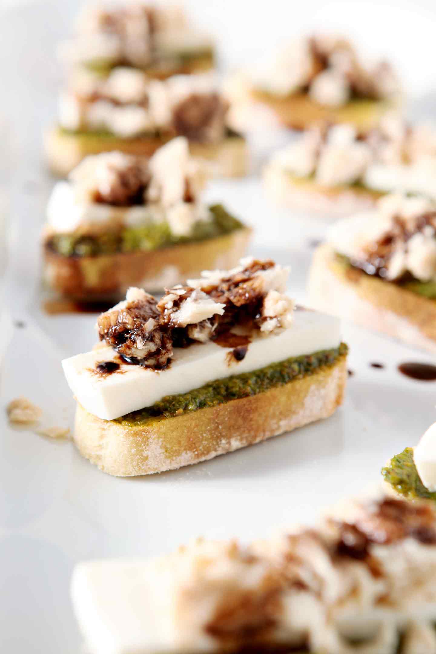 close up of a tuna pesto crostini