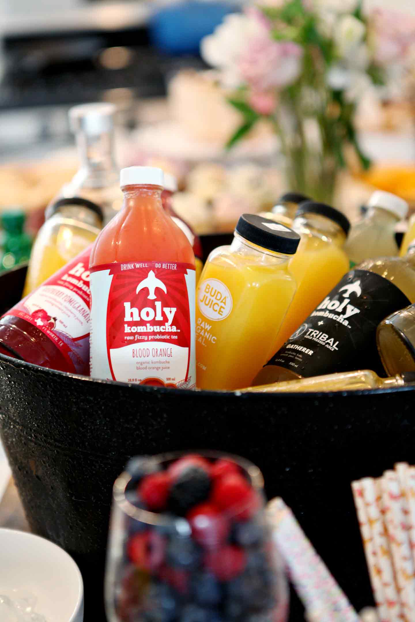 Glass bottles of juice in a bucket 