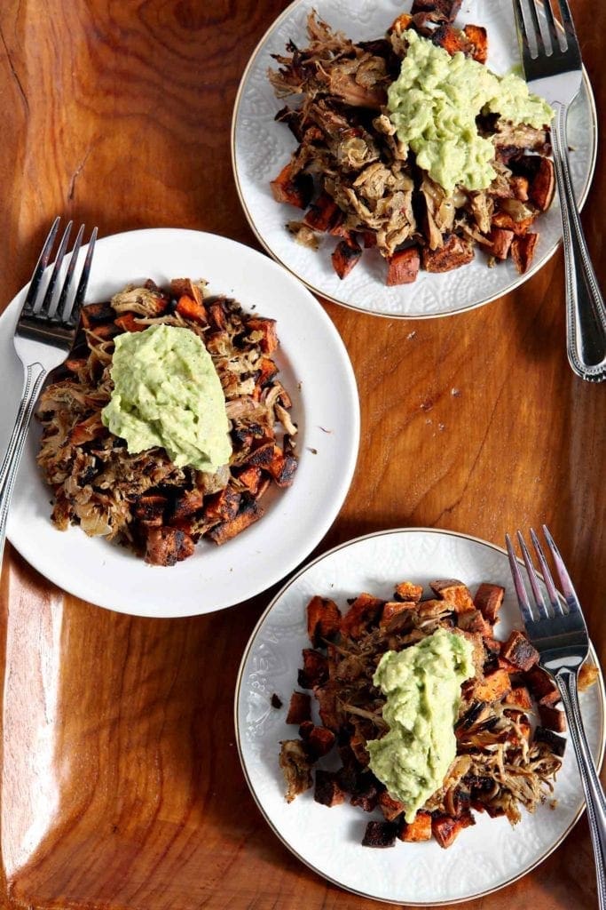 Slow Cooked Pork with sauce on top served on 3 plates 