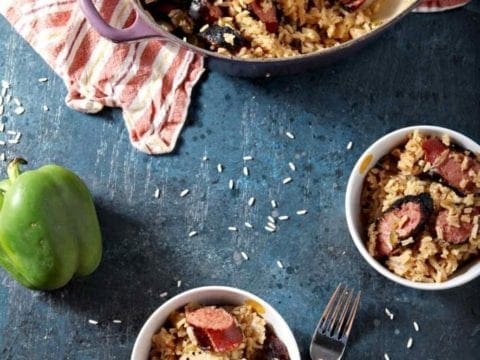 turkey sausage jambalaya in a large dish and in two small bowls