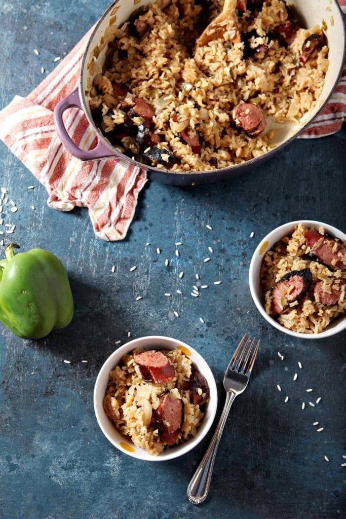 turkey sausage jambalaya in a large dish and in two small bowls