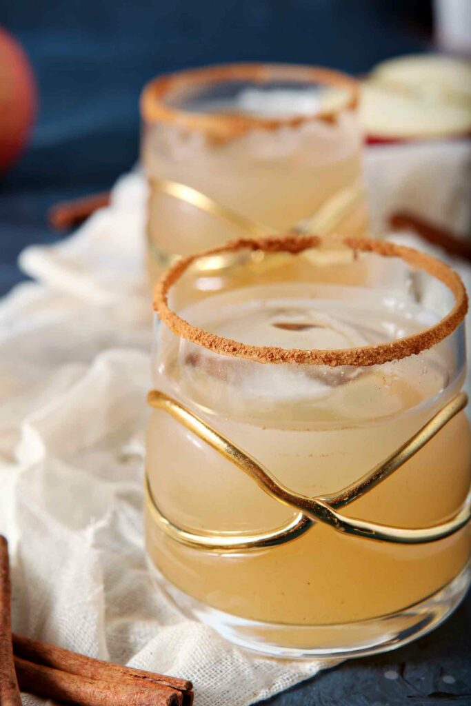 Closeup of a fancy gold-decorated glass holding a brown cocktail