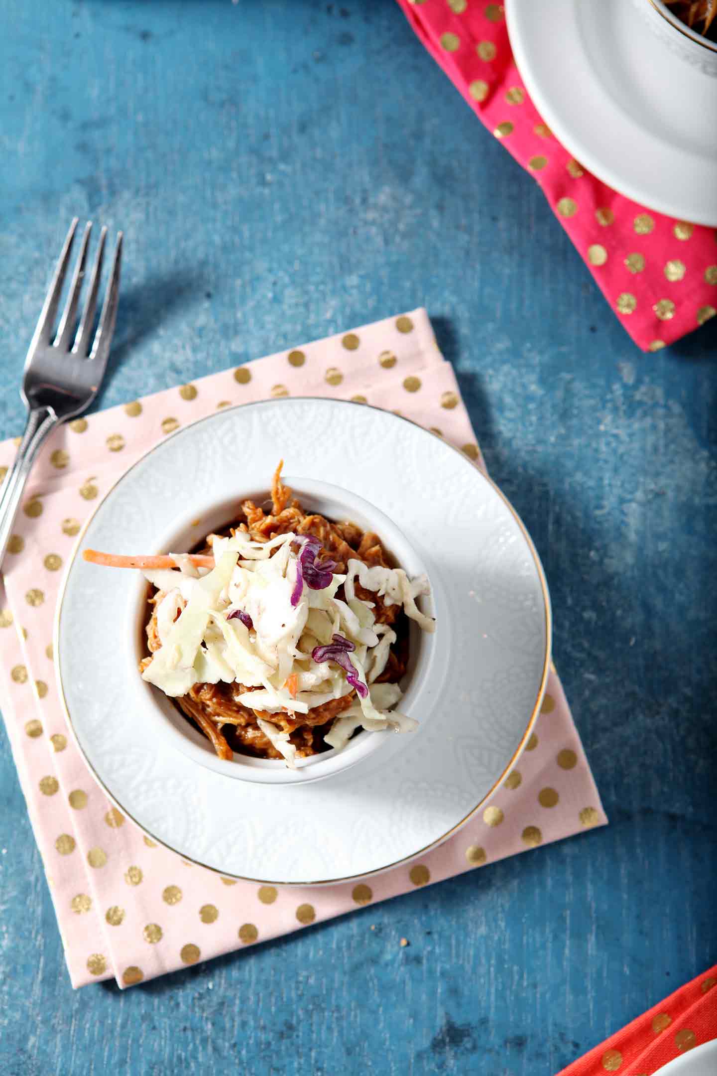 Overhead of a bowl, topped with coleslaw