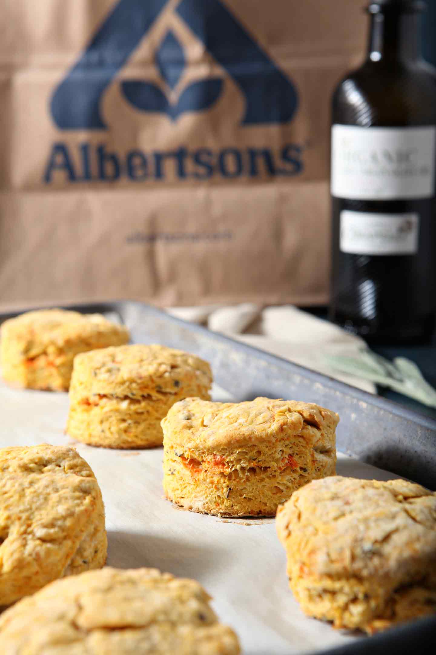 sweet potato olive oil biscuits with a paper bag in the background