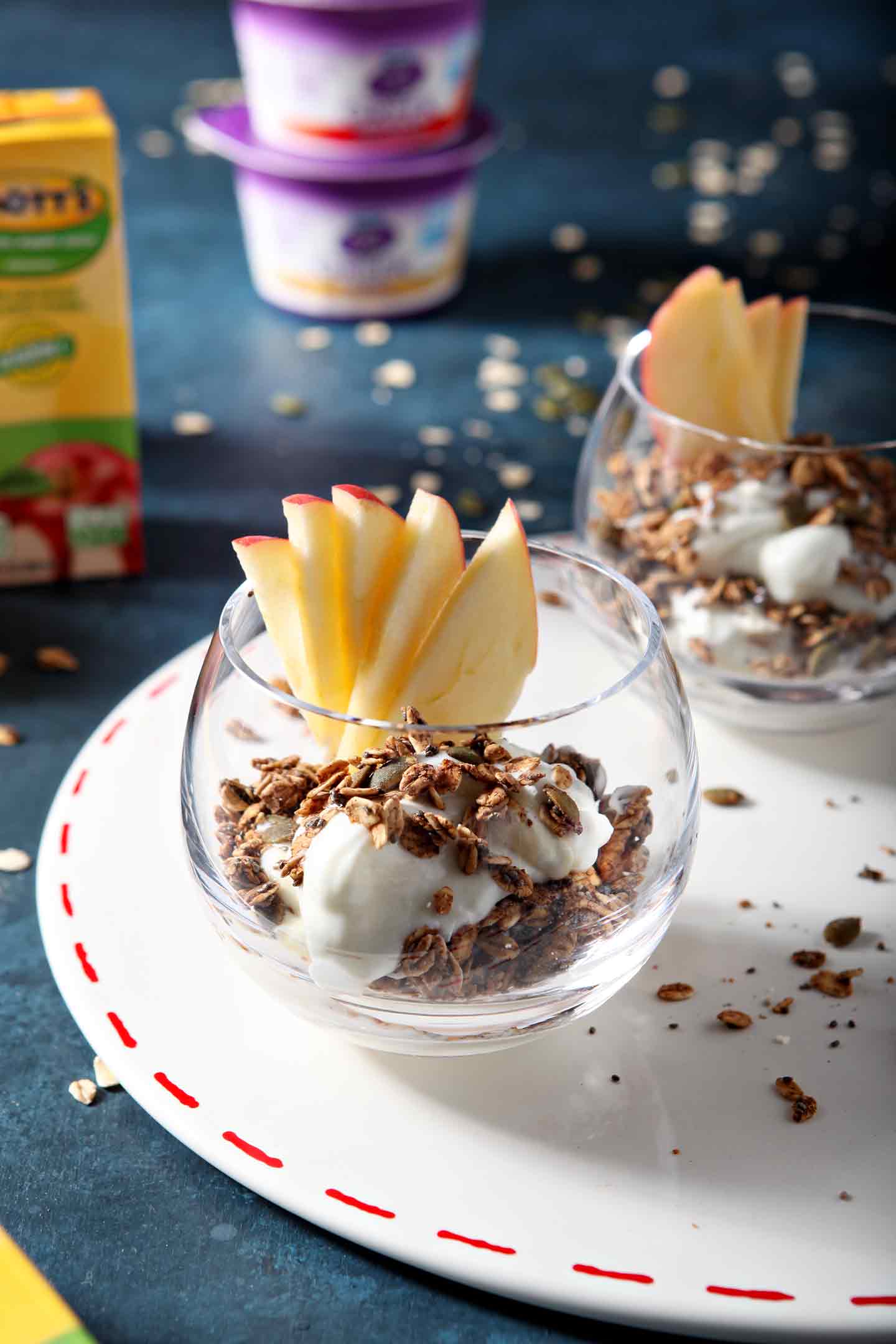 yogurt parfait in a glass cup with apple slices