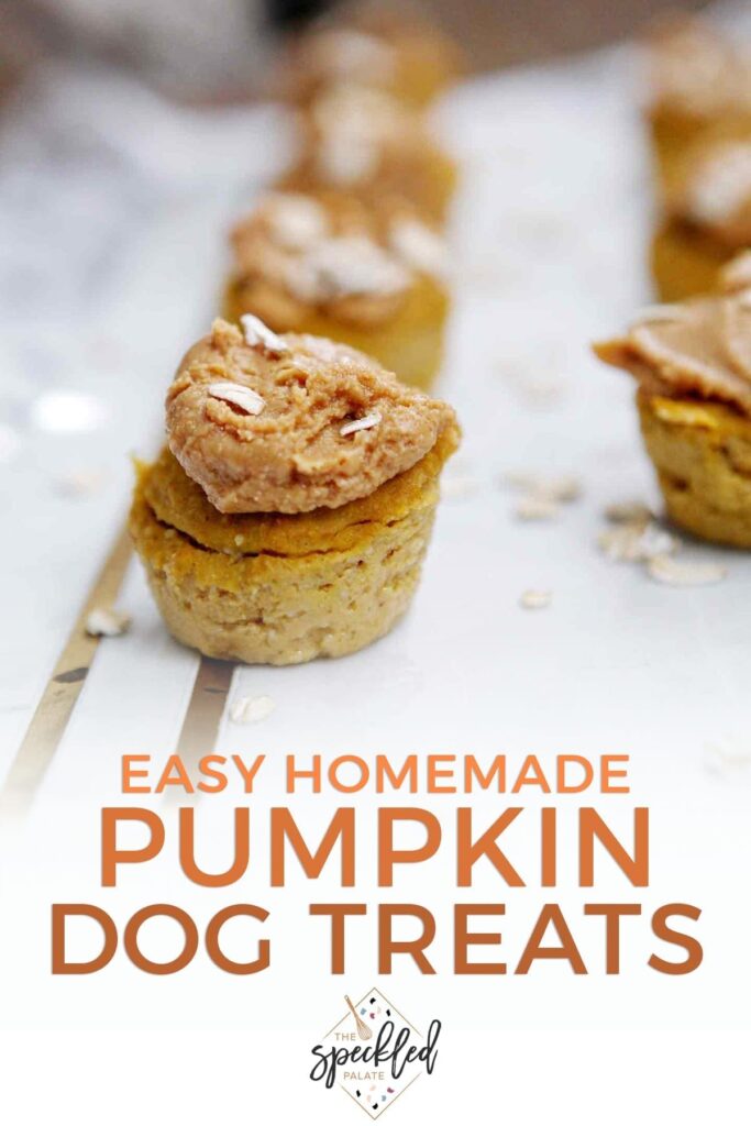 Several Peanut Butter Pumpkin Pupcakes are lined up on a marble slab with the text 'easy homemade pumpkin dog treats'