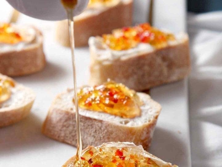 drizzling honey on bruschetta