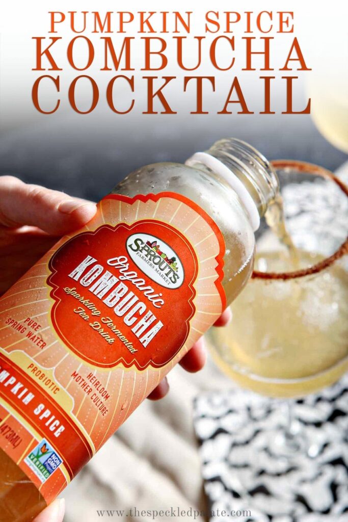 Sprouts kombucha pours into a wine glass with the text 'pumpkin spice kombucha cocktail'