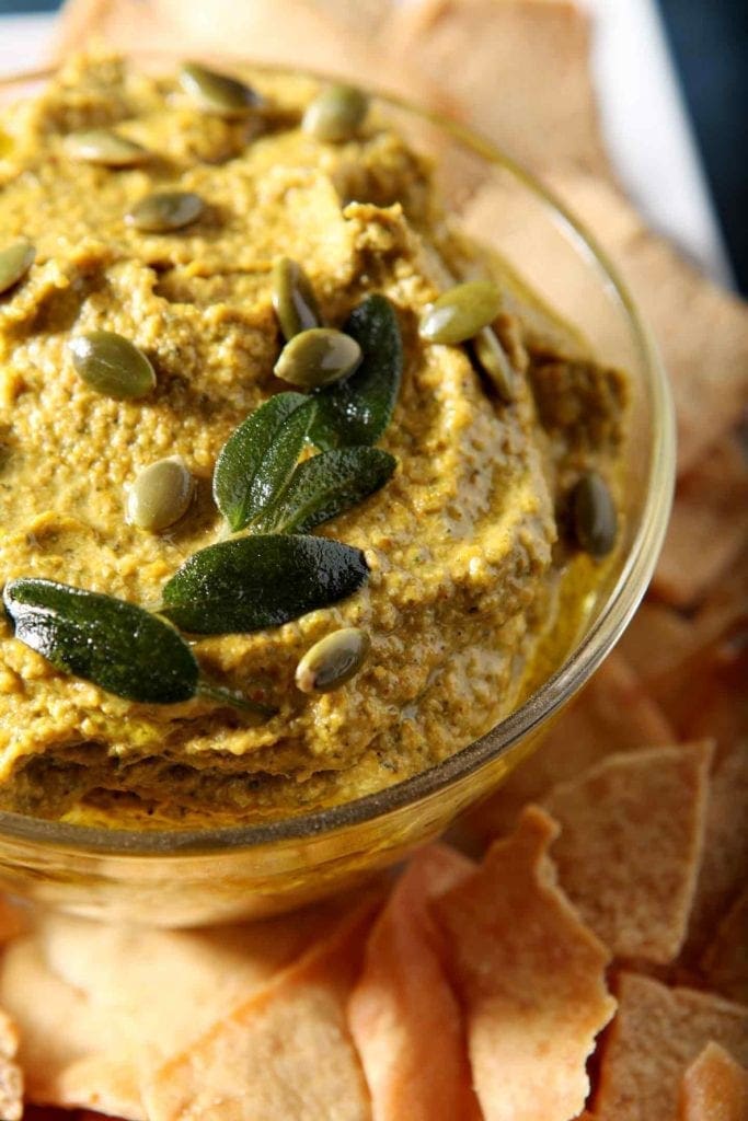 Close up of the final dip, topped with toasted sage leaves and pepitas