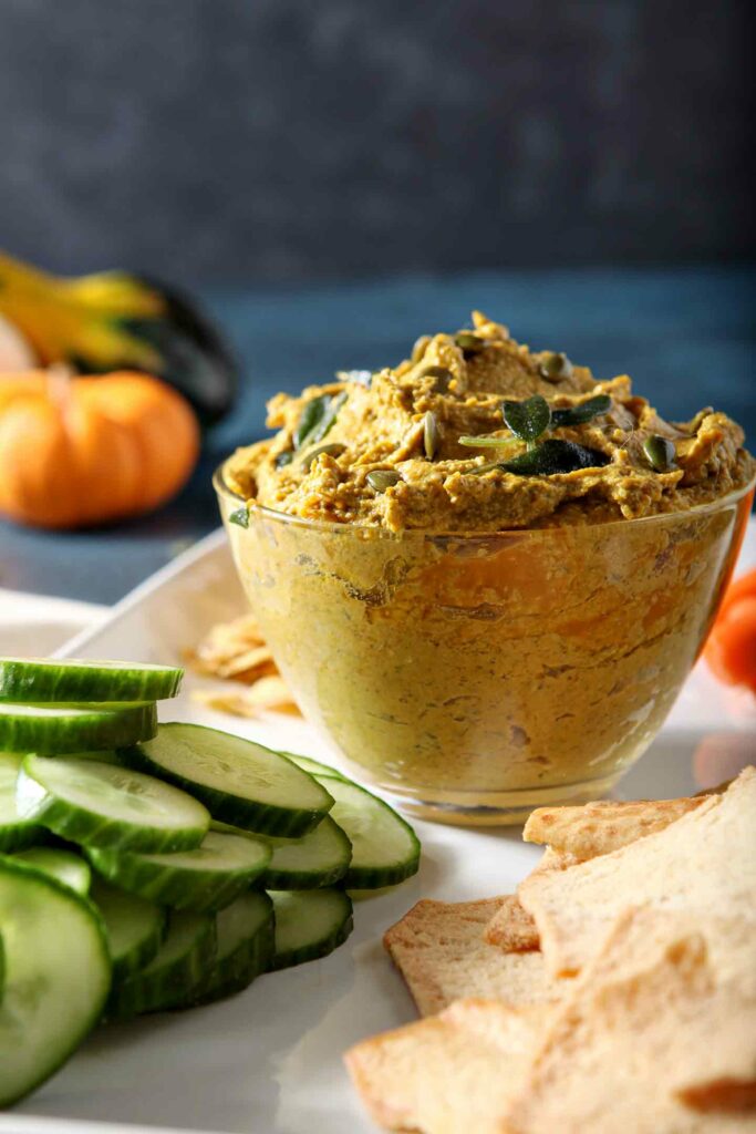 Close up of a bowl of the Sage Pumpkin Hummus, from the side