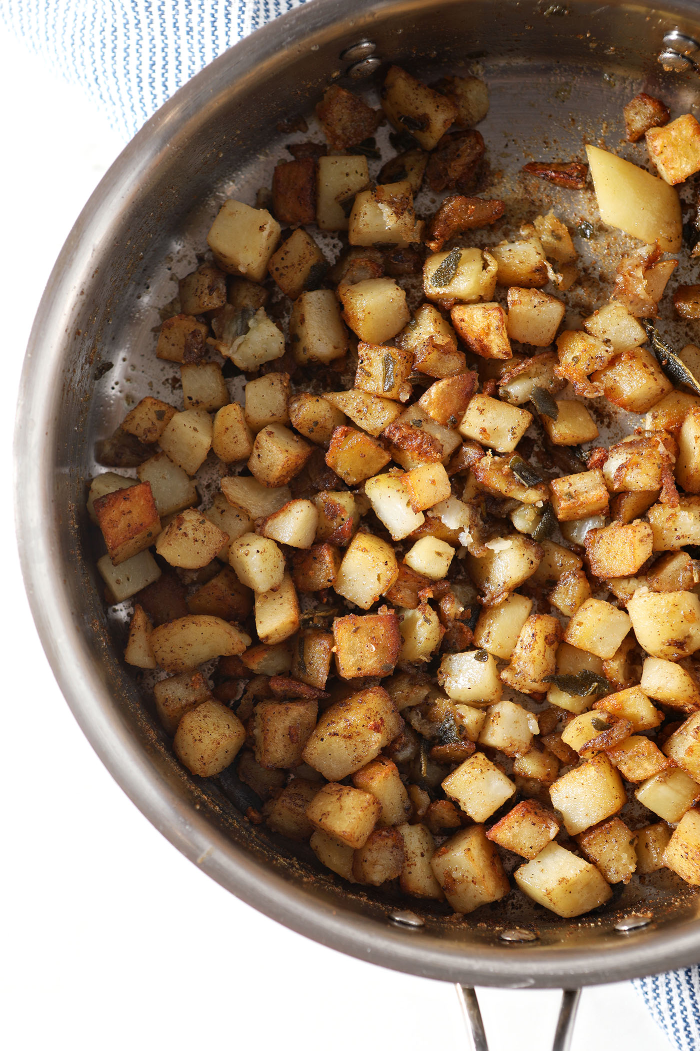 Golden brown home fries in a skillet