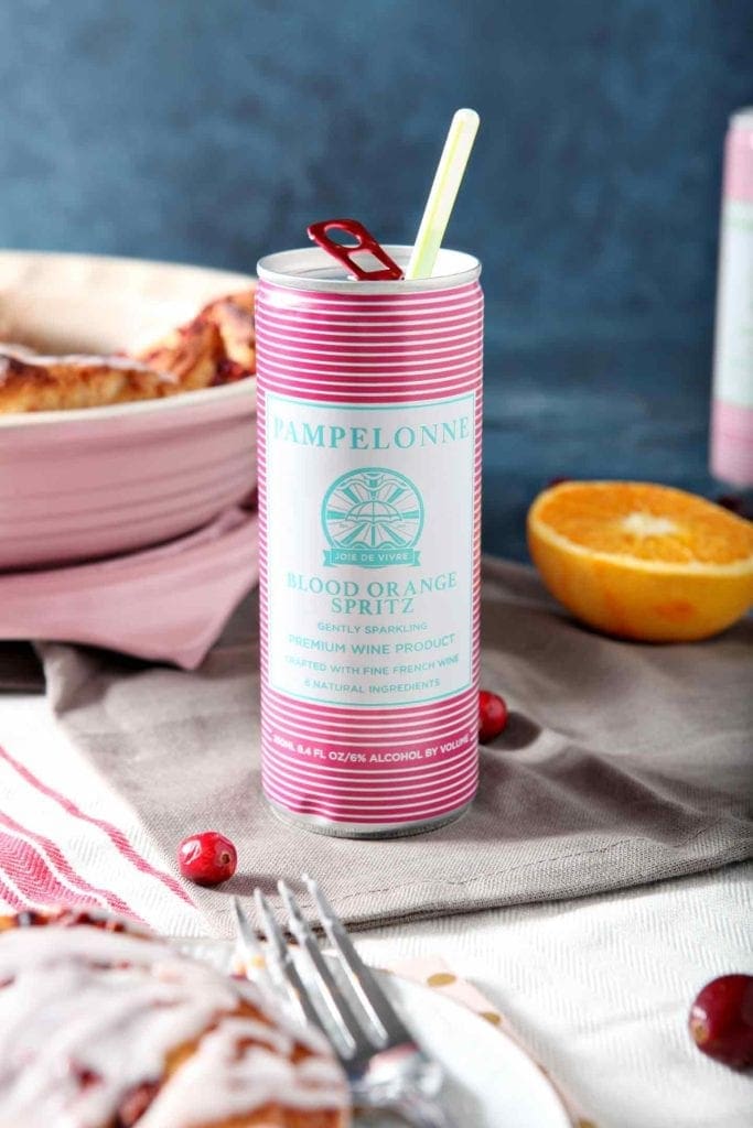 a canned blood orange spritz with a straw