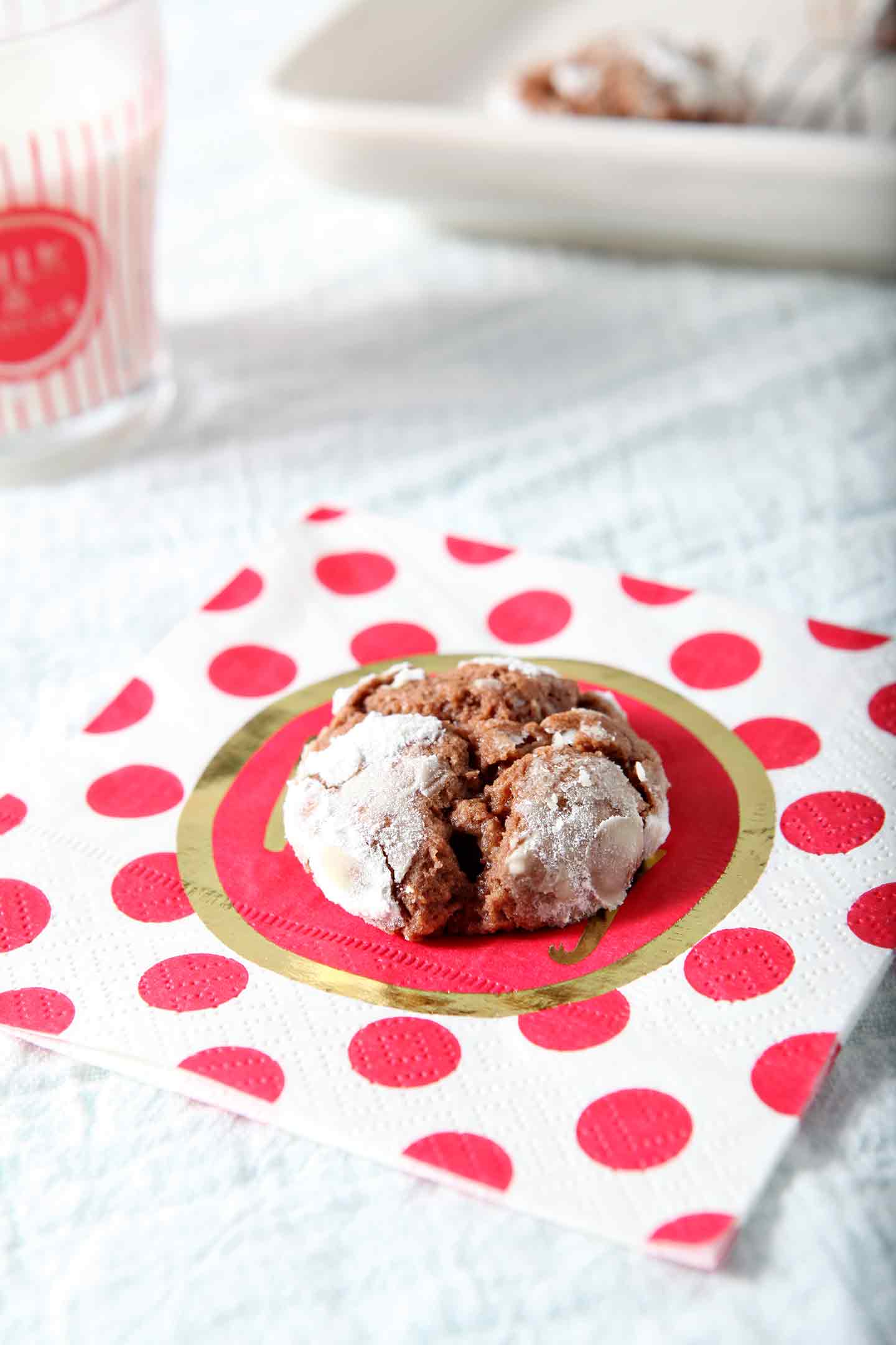 chocolate crinkle cookies on a red polka dot napkin